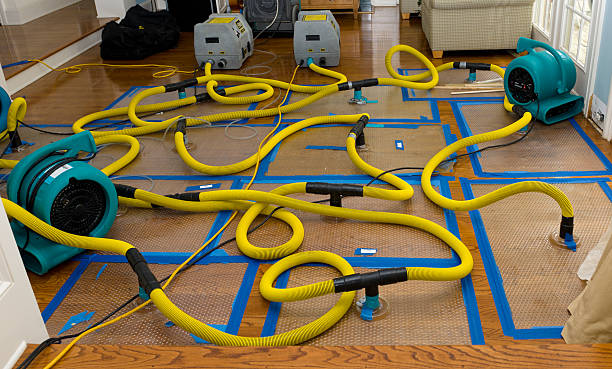 Professional Flood Damage Restoration technician working in Inchelium, WA